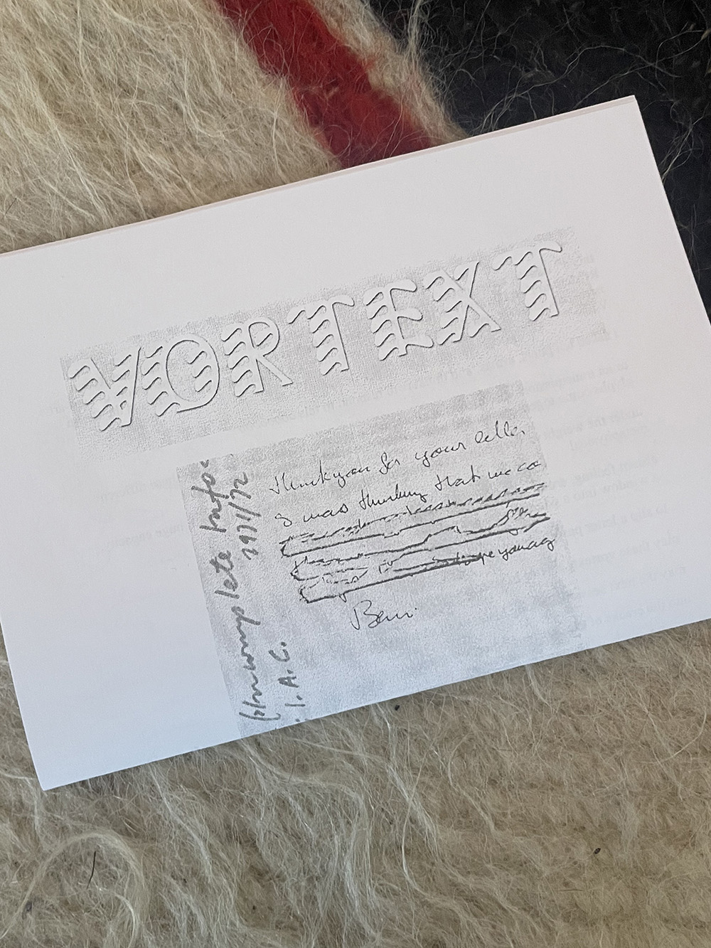 A photograph of the fourth issue of VORTEXT, folded in half, with a letter written by Fluxus artist Endre Tót to Ruth and Robert Rehfeld, written in the 1970s, as titel poem.